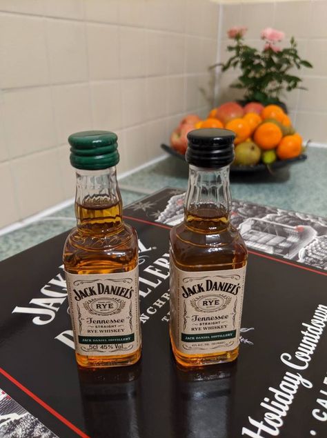 The one with the green cap is sold in England, and the other with the black is sold in the U.S. Green Cap, Rye Whiskey, Jack Daniel, Mini Bottles, Jack Daniels Whiskey Bottle, Jack Daniels, Rye, Scotch, Whiskey Bottle