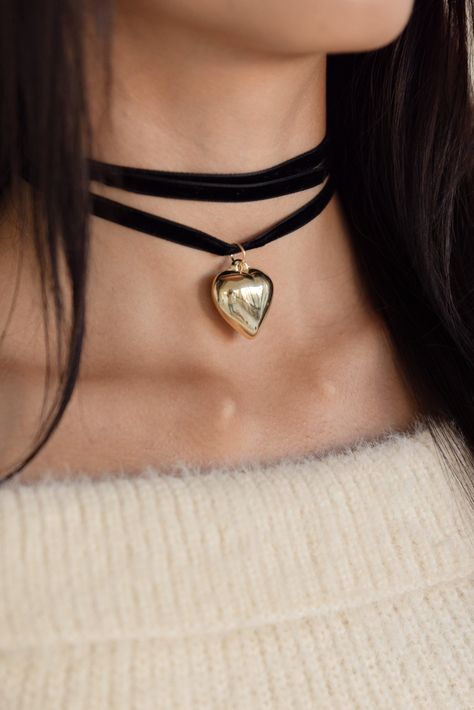 Our Velvet Bow Choker in black is a tie front choker necklace with gold heart details. #Timeless #A #Necklaces #Choker #of #of #Allure #Accessories #World #the #Exploring #Exploring #Statement #Fashion #The Black Bow Choker, Chockers Ideas, Black Choker Aesthetic, Black Choker Outfit, Chokers Aesthetic, Black Necklace Choker, Choker Necklace Outfit, Classy Aesthetics, Choker Ideas