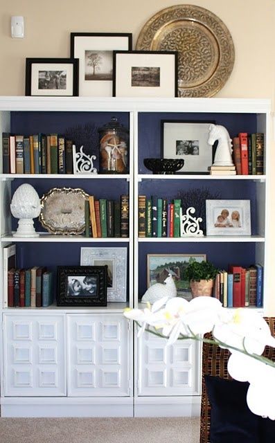 HIGH Five: 5 Tips for Decorating the tops of Bookcases and Armoires | ConfettiStyle Decorate Top Of Bookcase, Top Of Bookshelf Decor, Bookshelves Styling, How To Decorate A Bookshelf, Diy Bookshelf Design, Styling Bookshelves, Top Of Cabinets, Garden Magazine, Cool Bookshelves