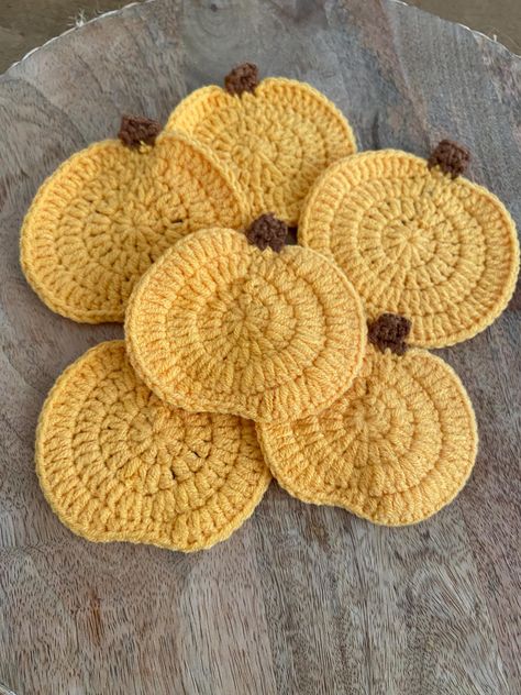 Add a cozy and festive touch to your home with our adorable crochet pumpkin coasters! Handwoven with care, these charming coasters are perfect for celebrating the Halloween season and bringing autumn vibes to your space.  Size: 9cm x 10cm / 4in x 3.5in Make your fall décor even more special with these cute and practical crochet pumpkin coasters! Sold as a set of 2. Fall Decorations Kitchen, Crochet Pumpkin Coaster, Practical Crochet, Pumpkin Coasters, Home Decor Halloween, Fall Crochet, Autumn Home Decor, Crochet Halloween, Adorable Crochet