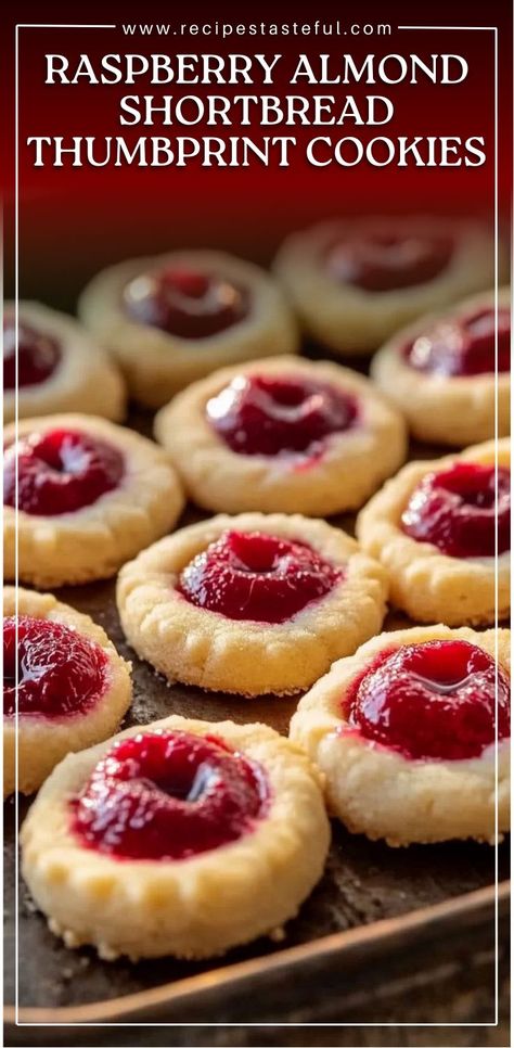 These Raspberry Almond Shortbread Thumbprint Cookies are buttery, sweet, and have a delicious fruity center with a hint of almond. Perfect for the holiday season or any special occasion, they are sure to be a hit with family and friends. The soft shortbread, combined with the sweet raspberry jam and crunchy almond garnish, creates a delightful bite-sized treat. Shortbread Thumbprint Cookies Recipe, Shortbread Thumbprint Cookies, Best Thumbprint Cookies, Best Shortbread Cookies, Raspberry Thumbprint Cookies, Jam Thumbprint Cookies, Almond Shortbread, Almond Shortbread Cookies, Christmas Cookies Gift