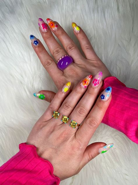 Rainbow flower nails acrylic almond shape Rainbow Flower Nails Short, Rainbow Daisy Nails, Pride Flower Nails, Pride Nails Almond Shape, Rainbow Floral Nails, Pastel Pride Nails, Pride Themed Nails, Rainbow Rhinestone Nails, Pride Nails 2023