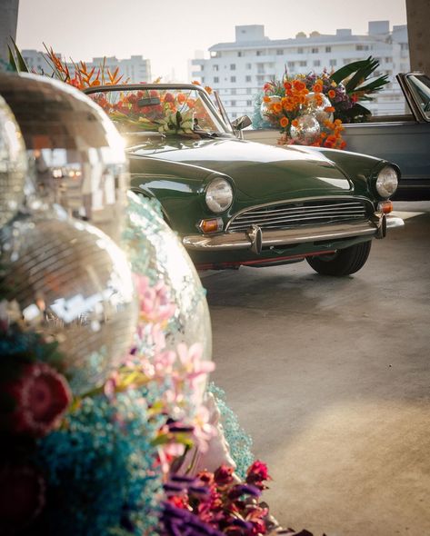 For the Welcome Party, we turned a parking garage into a Tropical Disco!⁣ 🪩🌴🍍 ⁣ #DiwanByDesignWeddings #WelcomeParty #MiamiWedding #DestinationWeddingPlanner #DecorDetails #WeddingWeekend ⁣ Team:⁣ Photographer: @baileyannoriginal Planner: @diwanbydesign ⁣ Design + Decor + Florals:⁣ @bircheventdesign ⁣ Venue: @eventspaceat1111 Videographer: @modernloveproductions ⁣ Catering:⁣ @thierryisambert ⁣ DJ:⁣ @desijunctiondjs @klasikhz @virksimba ⁣ AV:⁣ @averproductions ⁣ Musicians:⁣ @steelpandex ⁣ Su... Tropical Disco, Super 8 Film, Welcome Party, Super 8, Miami Wedding, Parking Garage, Welcome To The Party, Destination Wedding Planner, Wedding Weekend