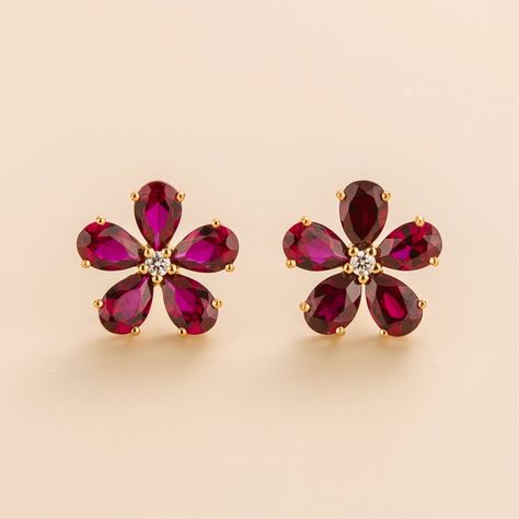 Florea earrings in 18K pink gold vermeil set with Ruby and DiamondRuby: 5.0 carats (10 of 6mm x 4mm pear cut stones)Diamond: 0.1 carats (2 of 2mm round cut stones)Options available to make the earrings in 9K, 14K and 18K gold. Please contact us at contactus@juvetti.com. Our precious jewellery is designed to preserve its original brilliance over time. There are a few precautions to make sure to keep your jewellery in the best condition.Your jewellery should be cleaned regularly using clean and dr Flower Earrings Gold, Ruby Earrings Studs, Round Flower, Bridal Gold Jewellery Designs, Gold Earrings Designs, Ruby Earrings, Bridal Gold Jewellery, Christmas 2023, Pear Diamond