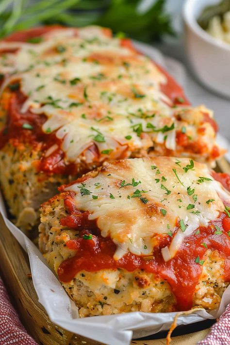 Dive into a mouthwatering twist on classic meatloaf with our Parmesan Chicken Meatloaf recipe! Packed with flavor, it's a family favorite. Try it tonight! Chicken Parmesan Meatloaf Muffins, Chicken Parm Mini Meatloaf, Keto Beef Recipes For Dinner, Garlic Parm Meatloaf, No Red Meat Dinner Ideas, Garlic Parmesan Chicken Mini Meatloaf, Garlic Parm Chicken Meatloaves, Parmesan Chicken Meatloaf, Garlic Parmesan Meatloaf