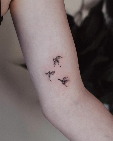 Tiny Dragons Minimalist Tattoos Dragon Tattoo For Women Minimalist, Dragon Tattoo Tiny, Dragon Tiny Tattoo, Tiny Dragons Tattoo, Tiny Tattoo Men, Greek Myth Tattoo Simple, Tiny Dragon Tattoos, Girly Dragon Tattoo, Dragon Tattoo Minimal