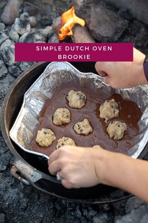 If you are looking for a dutch oven dessert idea for your next camping trip, I have the perfect recipe for you. This dutch oven brookie is so simple to make, as most the ingredients are packaged, so it comes together quickly and with minimal effort. You are going to love this dessert that is the best of both worlds- brownies and chocolate chip cookies. You don't want to miss this recipe! Dutch Oven Dessert, Dutch Oven Dessert Recipes, Campfire Dutch Oven Recipes, Brookie Recipe, Dutch Oven Desserts, Dutch Oven Recipes Cast Iron, Camping Dessert Recipes, Brookies Recipe, Dutch Oven Camping Recipes