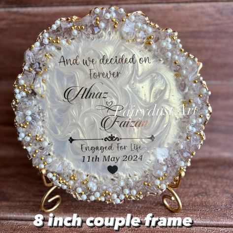 Couple frames are a trendy and aesthetic gift to decorate the room . Dm to order yours @fairydustart_16 . [ couple gift, couple gifts, anniversary gift, anniversary gifts, wedding gift, wedding gifts, anniversary gift] Couple Gifts For Both Anniversary, Resin Art Ideas For Couples, Resin Frames For Couples, Resin Art Wedding Gift, Anniversary Frame Ideas, Resin Frame Ideas, Engagement Gift Ideas For Couples, Raisin Art, Engagement Tray