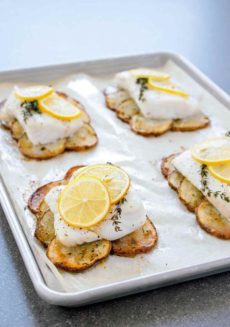 This elegant one-pan meal of lemon roast fish with potatoes is fancy enough for guests but completely doable on a weeknight. #weeknight #fishrecipes #onepan Fish With Potatoes, Roasted Cod, Roast Fish, Lemon Herb, Edamame, Fish Dishes, Fish And Seafood, Fish Recipes, Seafood Recipes