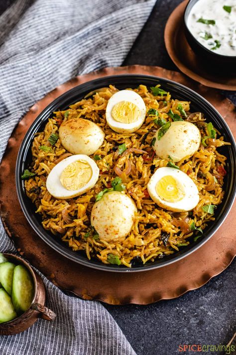 This Egg Biryani recipe in the Instant Pot stars delicately cooked eggs and rice with store-bought biryani mix for a one-pot vegetarian meal. #eggbiryani #instantpot #vegetarian Egg Fried Rice Recipe Easy, Egg Biryani Recipe, Egg Biryani, How To Reheat Rice, Egg Roast, Boiled Egg Recipes, Fried Rice Recipe Easy, Spicy Eggs, One Pot Vegetarian