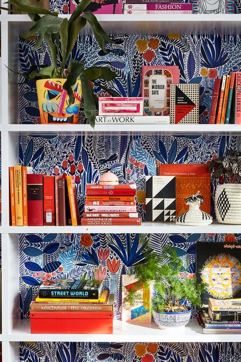 Maximalist Built In Shelves, Bookshelves Painted Inside, Bookcase Styling Maximalist, Knick Knack Display Ideas Living Rooms, Wallpaper Shelves Bookshelves, Wallpaper Backed Shelves, Maximalism Shelves, Wallpaper Behind Shelves Living Room, Wallpaper Back Of Bookshelf