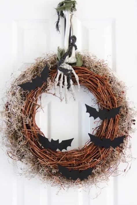 Here's a DIY Halloween wreath by Crafts Unleashed that is perfect for your front door. It starts out with a plain grapevine wreath and then decorations are added one by one, making it spookier with every step. You can make yours just like the tutorial or veer off and make your own spooky wreath. #diyhalloweenwreath#diyhalloweendecorideas #thespruce #halloweentreatideas #diyhalloweenpartyideas #halloweenparty Homemade Door, Bat Wreath, Halloween Wreath Ideas, Spooky Diy Halloween Decor, Halloween Decorations Apartment, Spooky Diy, Bat Craft, Wreath Inspiration, Spooky Wreath