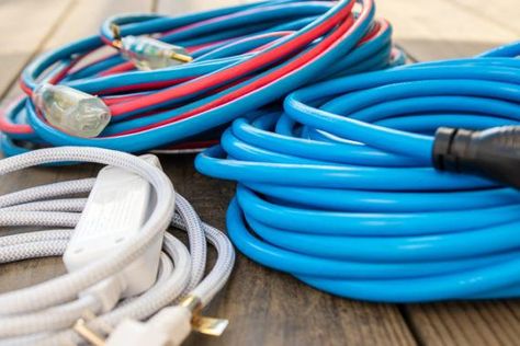 The Best and Worst Ways to Store Extension Cords: Reviews by Wirecutter | A New York Times Company Store Extension Cords, Garage Extension, Outdoor Extension Cord, Long Extensions, Interior Minimal, Sign Board Design, Extension Cords, Cord Storage, Be Dangerous