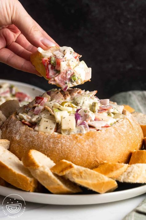 This Italian Hoagie Dip served in a bread bowl is like your favorite Italian sub- but in spreadable dip form! It's simple to make and so tasty. Dips In Bread Bowls, Bread Bowl Dip Recipes, Italian Hoagie Dip, Hoagie Dip, Bread Bowl Dip, Italian Hoagie, Bread Dip, Sub Sandwiches, Bread Bowl