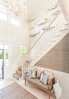 Eclectic stairway in a coastal home Stairway Gallery Wall, Coastal Gallery Wall, Cottage Coastal, Unique Gallery Wall, Coastal Living Rooms, Interior Design Photos, Beach House Interior, Nautical Home, Coastal Interiors