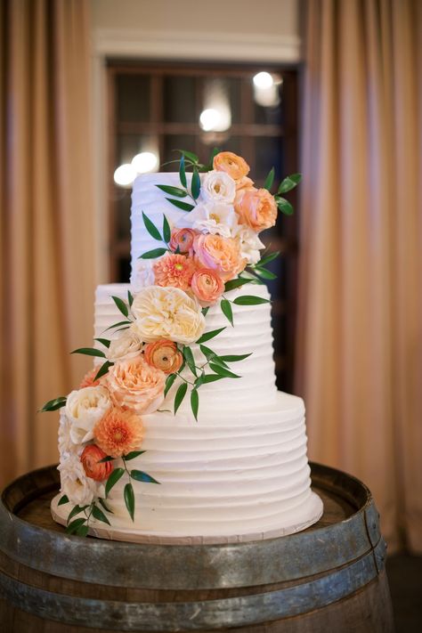 A beautiful strip of garden roses, ranunculus, and dahlias cut diagonally through this stunning wedding cake. Ranunculus Wedding Cake, Dahlia Wedding Cake, Wedding Cake Dahlia, Wedding Cake Ranunculus, Dahlia Cake Flowers, Ranunculus On Cake, Wedding Cake Dahlia Flowers, Buttercream Dahlia, Dahlia And Zinnia Wedding Bouquet