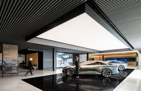 Lucid Motors, Car Showroom Design, Black Terrazzo, Pivot Doors, Car Showroom, Showroom Design, Luxury Sedan, Retail Space, Concrete Floors