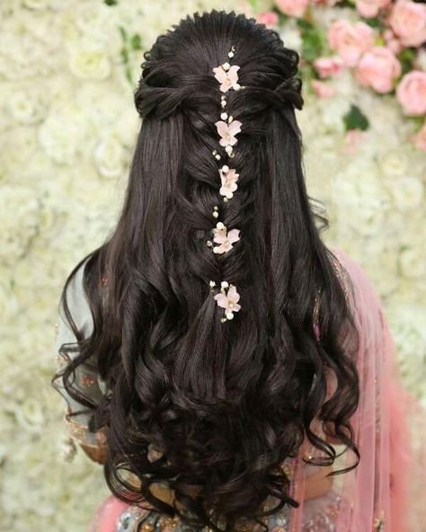 Pick out gorgeous hairstyles for garba night from here! #garba #garbanight #garbanighthairstyles #hairstyles #bridalhairstyles #navratri #navratrihairstyles #gujratihairstyles #garbadress #garbaoutfit #navratrioutfit #dandiyaoutfit #dandiyahairstyle Reception Hairstyles, Bridal Hair Decorations, Side Braids, Hair Style On Saree, Prom Hairstyle, Engagement Hairstyles, Bridal Hairdo, Bridal Hair Buns, Indian Wedding Hairstyles