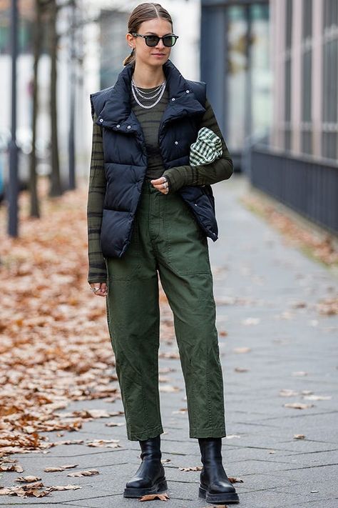 6 Ways to Wear a Puffer Vest in 2022, and 1 That’s Majorly Dated #purewow #outerwear #fashion #style #trends #shopping #shoppable #winter #street style #outfit ideas Street Style Winter 2022 Trends, Winter Street Style 2022 Women, Long Down Vest Outfit, Fall 2022 Street Style Trends, 2022 Winter Street Style, Europe Winter Street Style, Fall Winter 2022 2023 Street Style, Street Style Winter 2022 2023, 2022 Fall Street Style