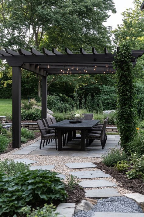 ♥ Looking to create a cozy outdoor oasis in your backyard? Explore this modern covered pergola patio design attached to the house. Get inspired by Mediterranean style and shade ideas. Discover patio furniture inspo and decorating ideas for a relaxing space! 🌿🏠🌞 #PergolaPatio #ModernDesign #CoveredPatio #OutdoorLiving #PatioIdeas #BackyardDesign #CozyPatio Back Patio Landscaping, All Gravel Backyard, Mediterranean Outdoor Patio, Mediterranean Backyard Ideas, Covered Pergola Patio, Flagstone Patio Design, Mediterranean Backyard, Black Pergola, Attached Pergola