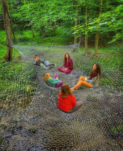 Come to New Moon Retreat in North Carolina to socialize, hangout, and even meditate right above the water! Tree Netting Hammock, Outside Fort Ideas, Net Tree House, Nature Play Backyard, Woods Hangout Spot, Forest Fort, Large Hammock, Tree Net, Net Hammock