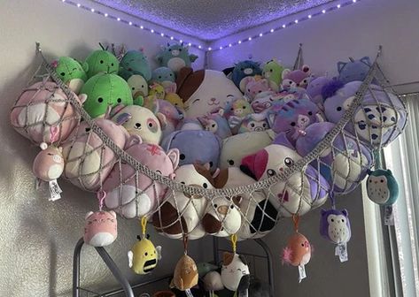 15 Best Squishmallow Storage Ideas (2022 Updated) Hanging Nets For Stuffed Animals, Squishmallows Hanging Net, Stuffed Animal Net Diy, Shelf Of Stuffed Animals, Squishmellow Hammock, Net To Hold Stuffed Animals, Corner Net For Stuffed Animals, Nets For Stuffed Animals, Crochet Stuffed Animal Storage