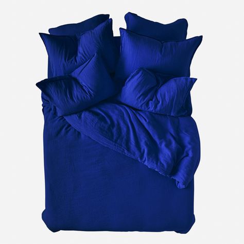 43 of the best places to buy bedding and bed sheets to buy now | House & Garden Bed Sheet Ideas, Blue Bed Linen, Indigo Bedding, Paris Flat, Blue Linen Bedding, Blue Bed, Covers Bed, Best Bedding Sets, Organic Cotton Sheets