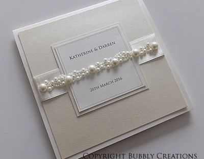 Extravagant Wedding Invitations, Classy Wedding Ideas Decor, Ivory Wedding Invitations Elegant, Wedding Pearl Accents, Elegant Wedding Cards, Wedding Dress Eith Pearls, Wedding Invitations Luxury, Pearl Wedding Details, Wedding Invitation Cards Elegant