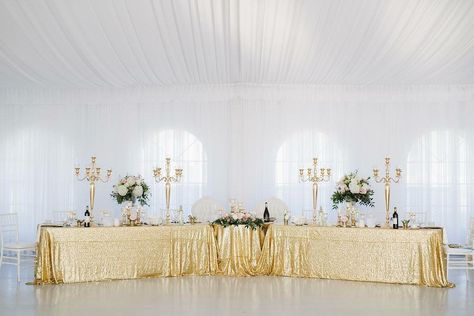 Tent wedding head table display with gold candelabras, sequins overlay table linens, and floral displays. #tentwedding #headtable #headtabledecor #sequinslinens #gold #goldheadtable #candelabras #goldcandelabras #weddingfloral Wedding Head Table, Head Table Backdrop, Gold Candelabra, Table Backdrop, Head Table Decor, Vintage Garden Wedding, Head Table Wedding, Head Tables, Table Skirt