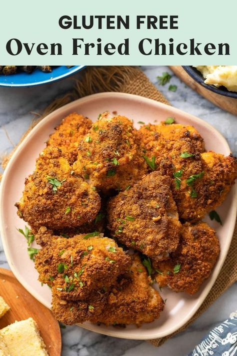 a plate full of gluten free oven fried chicken thighs Oven Baked Fried Chicken, Gluten Free Fried Chicken, Chicken Gluten Free, Baked Parmesan Crusted Chicken, Oven Fried Chicken Recipes, Baked Fried Chicken, Crispy Oven Fried Chicken, Baked Chicken Recipe, Baked Chicken Tenders