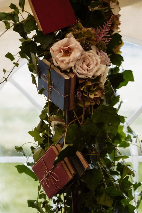 An arch decorated with vintage books and Roses , stunning www.simplyvintageevents.co.uk Book Wedding Arch, Book Arch Wedding, How To Make A Book Arch, Book Themed Sweet 16, Book Inspired Wedding, Literary Wedding Theme, Library Themed Wedding, Rustic Library, Book Arch