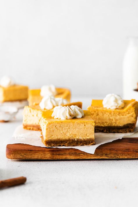 Simple and delicious Gluten Free Cheesecake Bars are easy to make and are a great pumpkin dessert for Thanksgiving! Cheesecake bars are quicker to make than a regular cheesecake. They’re portable and are a great option for make-ahead desserts to bring to a holiday dinner. Pumpkin cheesecake bars can also be made with regular graham crackers if you don’t need gluten free. Gluten free cheesecake recipe from @whatthforkblog - visit whattheforkfoodblog.com for more gluten free baking and desserts. Gluten Free Cheesecake Recipes, Gluten Free Pumpkin Cheesecake, Gluten Free Pumpkin Bars, Gluten Free Pumpkin Recipes, Thanksgiving Dinners, Gluten Free Graham Crackers, Cheesecake Layer, Best Gluten Free Desserts, Pumpkin Cheesecake Bars