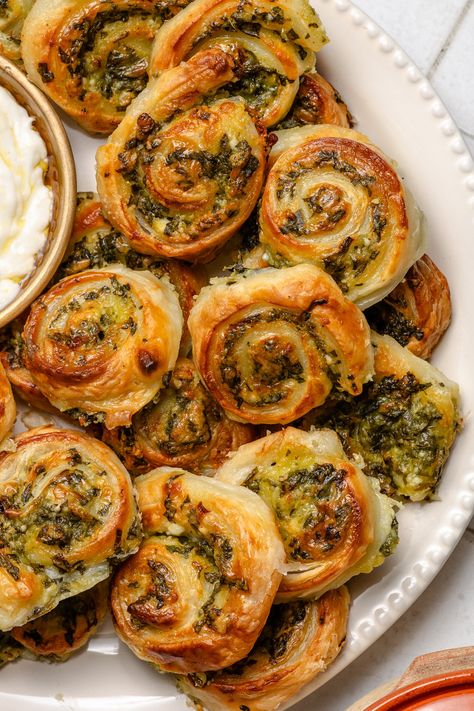 These Spinach and Feta Pinwheels are a quick spin on Greek Spanakopita. Cranberry Spinach Pinwheels, Spinach And Feta Pastry Rolls, Spinach Feta Stuffed Croissants, Spinach Feta Rolls, Spinach And Feta Pastries, Host Lunch Ideas, Mediterranean Pinwheel Appetizers, Puff Pastry Starters, Spinach Pinwheels Crescent Roll