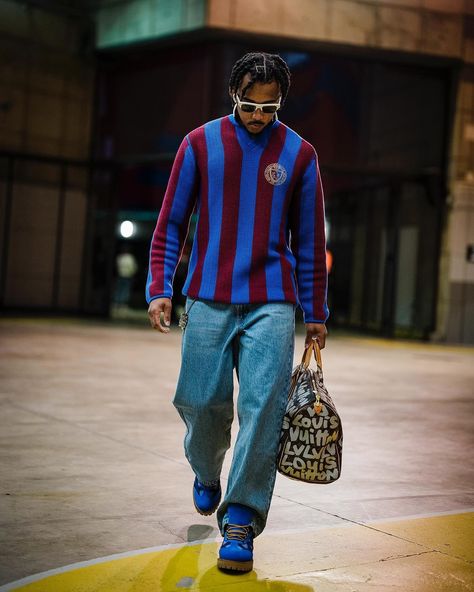 @jkeey4 is arguably @fcbarcelona's most stylish player right now. From his color coordination to his incorporation of emerging brands like @postarchivefaction in his rotation, it's hard not to notice his keen eye for fashionable fits.⁠ ⁠ The French footballer even took the forefront in the recent @adidas x @moncler collaboration a couple of months back. It's clear that he has his feet in the mud on the pitch and his hands in the fashion bag off it.⁠ ⁠ 📷️: @jkeey4 Kounde Drip, Kounde Outfit, Jules Kounde Outfit, Jules Kounde, Kanye West Outfits, Brazil Culture, Masc Fashion, Football Fashion, Street Fashion Men Streetwear