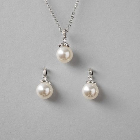 Simple yet alluring pearl earrings and necklace set. A single pearl hangs from a micro CZ accented drop for a little sparkle to your style. They are both about .75 inches long with a 10mm pearl and the necklace is 16 inches with a 2-inch extender. Available in rhodium or gold plate, they are lead, nickel, and cadmium-free. #bridesmaidgifts #weddinginspiration #weddingnecklaceset #bridalnecklace #bridalnecklaces #bridalnecklaceset #pearlpendant #pearlpendants Wedding Pearl Jewelry Set, Single Pearl Necklace Silver, Pearl Earrings And Necklace, Amethyst Jewelry Set, Pearl Jewelry Set, Wedding Necklace Set, Single Pearl Necklace, Earrings And Necklace Set, Vibe Check