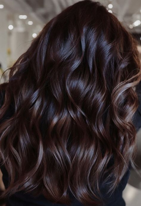 These glossy, espresso-colored waves offer a smooth, lustrous look. The deep brown tones bring out a rich, natural shine, while the soft waves add an element of playfulness to the style. The combination of a deep base and gentle movement creates a sophisticated and timeless appearance that is suitable for various occasions, from casual to formal. Deep Chocolate Brown Hair Color, Brown And Caramel Highlights, Dark Ash Brown Hair, Ash Brown Hair Balayage, Rich Brunette Hair, Brunette Hair Color Ideas, Espresso Hair Color, Hair Color Ideas For Winter, Deep Brown Hair