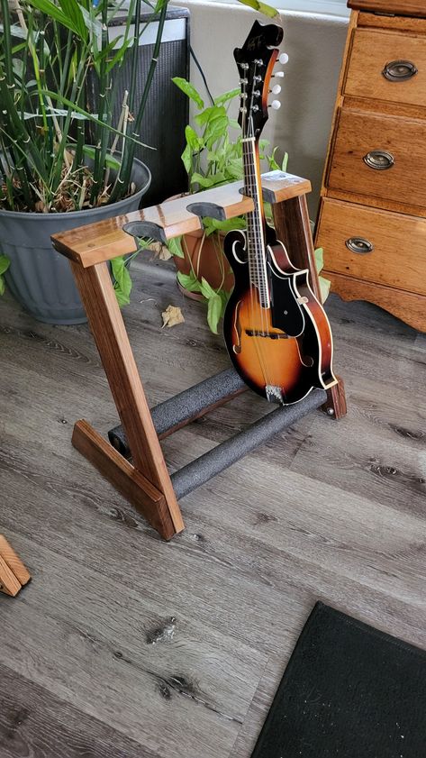 Top grade Walnut folding stand is perfect for ukes and mandolins. Other wood available i.e. Red Oak, Curly Maple, Cherry and more. Wooden Electric Guitar, Wood Guitar Stand, V Guitar, Ukulele Stand, Flying V Guitar, Guitar Storage, Wood Guitar, Guitar Stands, Activity Room