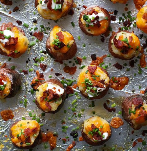 25 Easy Super Bowl Appetizers | Mini Twice-Baked Loaded Potatoes: Twice-baked potatoes are an underrated dinner: They’re creamy, cheesy, and seriously comforting. To transform them into a party-ready snack, we piled the filling into tiny new potatoes (instead of the traditional Idaho or russet). We added sharp cheddar cheese, chopped chives, and a sprinkling of bacon to give them the flavor of loaded potato skins.  #superbowl #appetizers #realsimple #recipe Baked Loaded Potatoes, Loaded Potatoes, Boys Food, Healthy Superbowl Snacks, Bowl Party Food, Superbowl Appetizers, Easy Potato Recipes, Appetizer Ideas, Mini Burgers