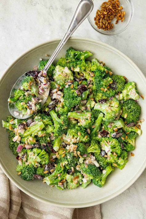 This creamy broccoli salad combines tender-crisp florets, toasted sunflower seeds, and dried cranberries, all tossed in a sweet and tangy dressing. | Broccoli Salad | Easy Broccoli Salad | Cold Broccoli Salad | Healthy Broccoli Salad | Cold Broccoli Salad, Best Broccoli Salad Recipe, Broccoli Salad With Cranberries, Creamy Broccoli Salad, How To Make Broccoli, Creamy Salad Dressing, Broccoli Salad Recipe, Cranberry Salad, Cold Salad