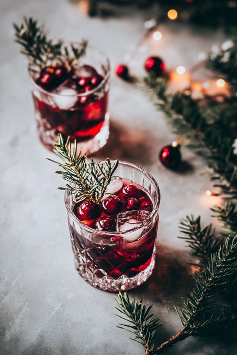 Christmas cocktails are the perfect way to add festive cheer to your holiday gatherings. From classic eggnog and mulled wine to trendy peppermint martinis and cranberry mimosas, there's a delicious cocktail for every taste.  Find easy-to-follow recipes for spiked hot chocolate, boozy punches, and warm winter drinks, plus tips for making your Christmas cocktail party a hit. Don't forget the festive garnishes like cinnamon sticks, candy canes, and sprigs of holly.  Looking for non-alcoholic options? We've got you covered with delicious Christmas mocktails. Christmas Cocktail Party Ideas, Spritzer Drink, Garnishing Ideas, Winter Mocktails, Modern Cocktails, Warm Winter Drinks, Christmas Mocktails, Classic Eggnog, Peppermint Martini