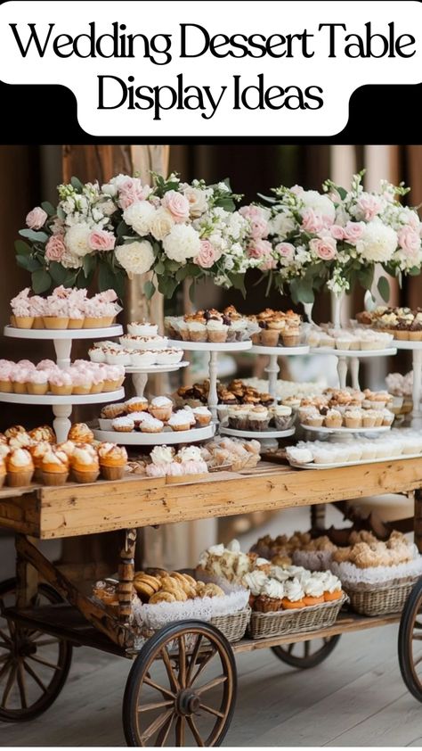 Elegant dessert table at a wedding with a wheeled cart, fresh fruit, and tiered cakes. Wedding Cupcake Table Ideas, Dessert Catering Display, Dessert Stations For Parties, Cookie Dessert Table Wedding, Wedding Dessert Bar Ideas Display, Unique Wedding Dessert Ideas, Wedding Expo Booth Ideas Bridal Show, Cookie Wedding Display, Sweet Table Wedding Elegant