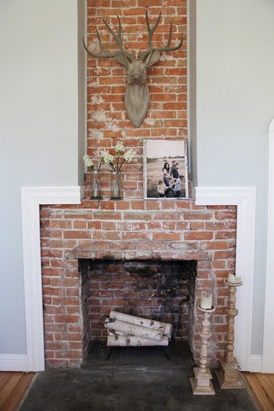 The sitting room is also home to one of the farmhouse's many showstoppers—this floor-to-ceiling brick fireplace that's beautiful in its rustic simplicity. Farmhouse Fireplace Mantel, Exposed Brick Fireplaces, Gaines Farmhouse, Gaines Fixer Upper, Farmhouse Decor Joanna Gaines, Joanna Gaines Farmhouse, Magnolia Fixer Upper, Hgtv Fixer Upper, Farmhouse Paint Colors