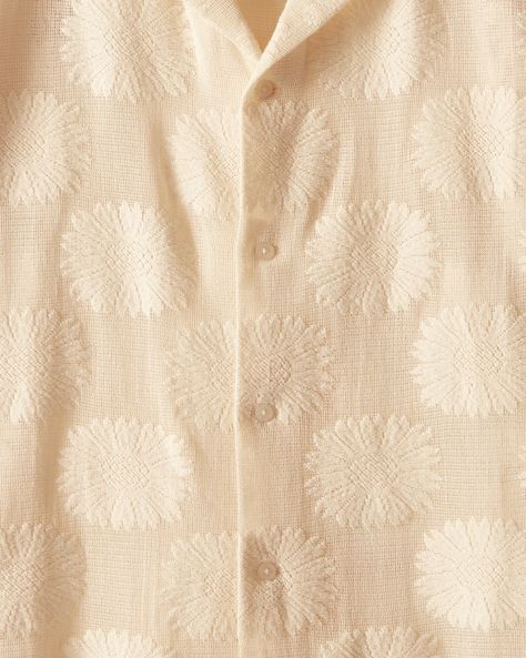 This shirt is inspired by a lace curtain from the 1930s-1950s and is part of Bode's lace development program. Made of ecru lace and patterned with sunflowers, it has a camp collar and a straight hem. The shirt features a hand-embroidered Bode logo on the back. Boxy fit Four front buttons 70% cotton 30% nylon Made in In Lace Curtain, New York Mens, Lace Curtains, Lace Short, Cut Shirts, Lace Shorts, Short Sleeve Shirt, Hand Embroidered, Sleeve Shirt