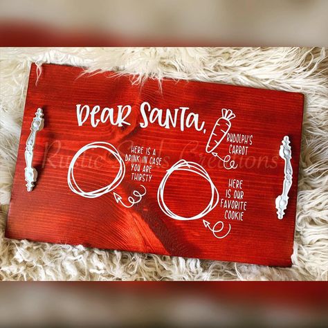 Dear Santa Tray with white handles $40 #DearSanta #CarrotsForRudolph #MilkForSanta #SantaTray #MerryChristmas #HappyHolidays #ChristmasDecor #CustomChristmasDecor #CustomSantaTray #VinylsByLena #RusticSoulsCreations #FindUsOnFacebook #FindUsOnEtsy #FindUsOnPinterest #WeTakeCustomOrders Dear Santa Tray, Santa Cookie Tray, Santa Tray, Santa Snacks, Wood Santa, White Handles, Snack Trays, Santa Cookie, Cookies And Milk