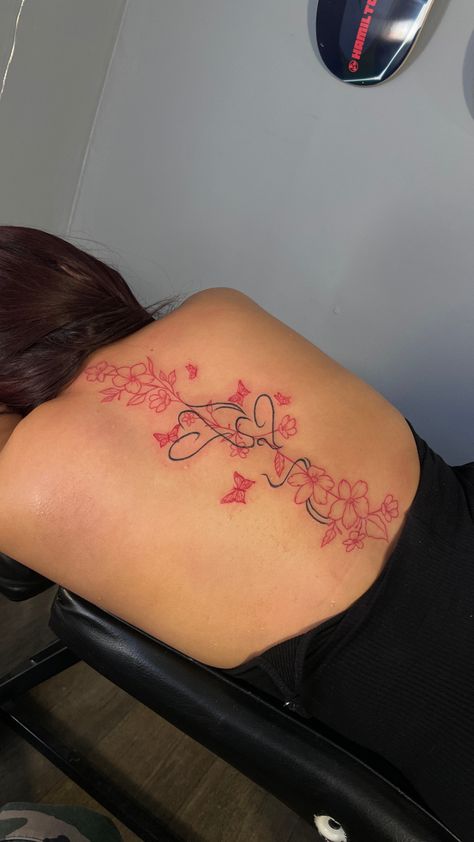 Spine Unique Tattoos, Spine Tattoos For Women Japanese Letters Red, Small Dragon Spine Tattoo, Red Spine Tat, Low Back Flower Tattoo, Back Tattoo Flowers Women, Red Flower Spine Tattoo, Black And Red Spine Tattoo, Spine Tattoo And Tramp Stamp