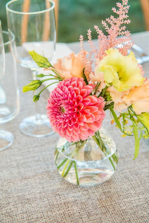 Short Flower Table Arrangements, Floral Simple Centerpiece, Candle And Floral Wedding Centerpieces, Colorful Simple Centerpieces, Bud Vase Table Decor Wedding, Rehearsal Dinner Bud Vases, Ranunculus Bud Vases Wedding, Colored Glass Vases Wedding, Dainty Flower Centerpieces