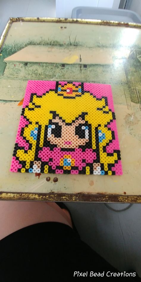 Princess peach perler Princess Peach Perler Bead Patterns, Princess Peach Pixel Art, Princess Peach Perler, Peach Perler, Kandi Perler, Perler Bead Mario, Mario And Princess Peach, Pixel Beads, Princesa Peach