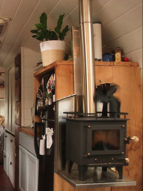 Safety considerations for installing a wood stove in an RV + reviews of different tiny wood stove models from full time RVers who use them. | rvinspiration.com Lean To Cabin, Rv Wood Stove, Short School Bus, Tiny House Wood Stove, Bus Conversion For Sale, Tiny Wood Stove, Countertop Makeover, Bus Living, School Bus Conversion