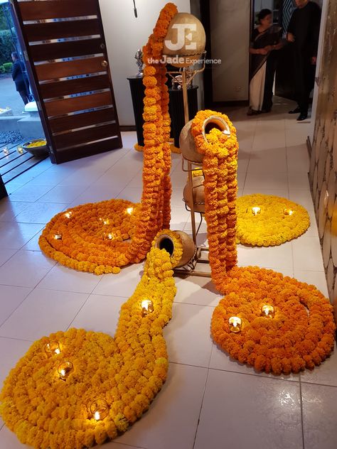 Entrance decor, Done with real marigolds and diyas. Elegant look for an evening function. Done by The Jadee Experience (Nairobi, Kenya.) #bigfatindianwedding #indiandecor #diyas #marigoldflowers #eventplanner Wedding Elegant Decoration, Flower Door, Decoration Event, Ganapati Decoration, Diwali Decorations At Home, Housewarming Decorations, Diy Diwali Decorations, Marriage Decoration, Desi Wedding Decor