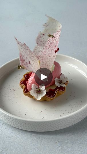 88K views · 8.9K reactions | (Recipe) Strawberry, Elderflower and Hibiscus 🌺🍓 - A delicious plated dessert that is a nod to spring with its floral notes. Putting this dessert together required some fun techniques with a striking tuile decoration (recipe below). What do you think?

Composition:
Phyllo tart shell
Strawberry elderflower confit
Hibiscus gel
Strawberry hibiscus mousse (quenelle shape), sitting on a chocolate disc 
Whipped vanilla ganache
Tuile decoration 

The tart shell is made of phyllo dough. To make it just melt butter, brush it on a sheet and place one on top, repeat for 3-4 layers. Cut using a cookie cutter and a sharp knife.

TUILE
30g egg whites, room temperature 
30g sugar
30g butter, very soft 
30g flour

Combine the sugar and butter, gradually add the egg whites, t Phyllo Tart, Strawberry Hibiscus, Vanilla Ganache, Plated Dessert, Recipe Strawberry, Sharp Knife, Tart Shells, Phyllo Dough, Plated Desserts